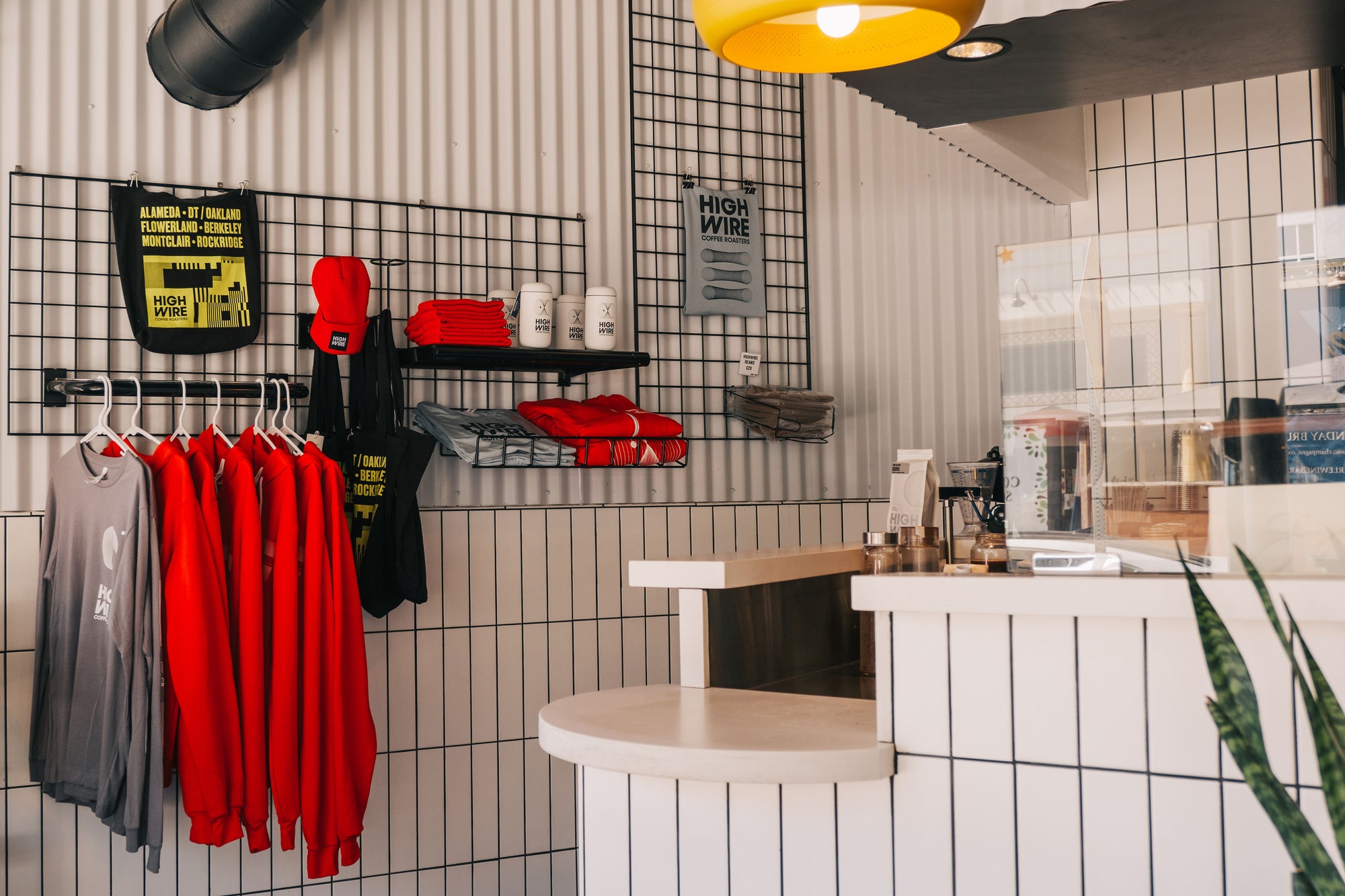 Branded merchandise hangs from the wall at Highwire's coffee shop in Montclair