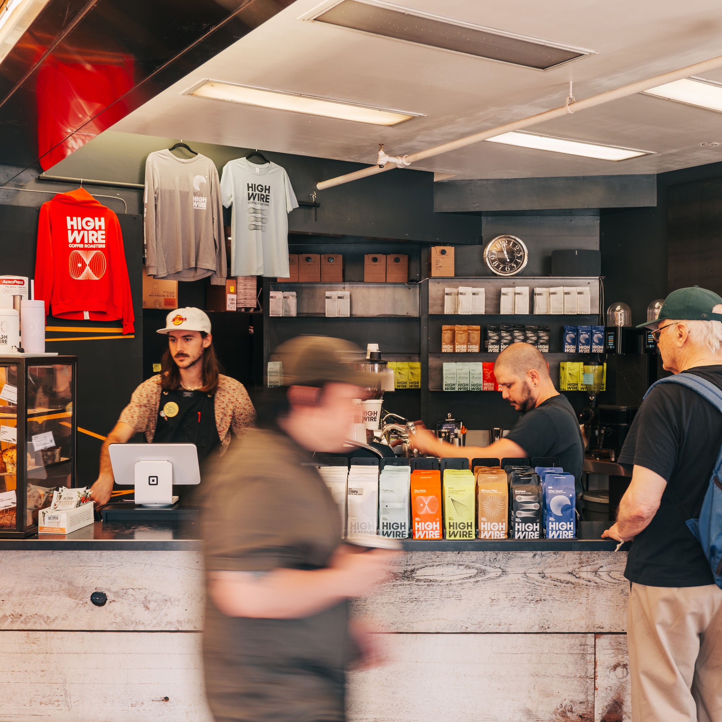 Baristas serving customers at Highwire's coffee shop in Rockridge