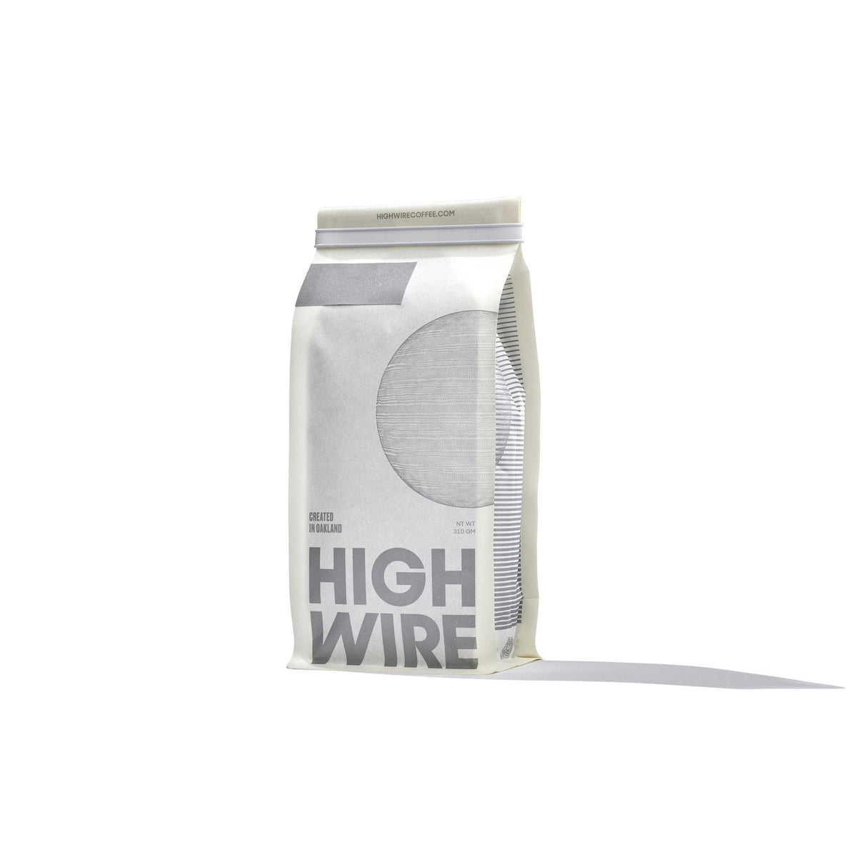 Front View of white Coffee bag labeled 'High Wire' on a white background