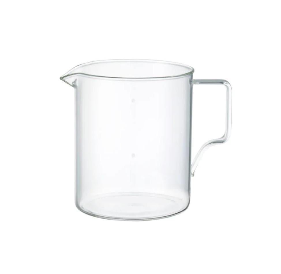 Clear glass pitcher on a white background