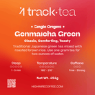 4 Track Tea Genmaicha Green tea packaging label with text and branding on a red orange gradient background