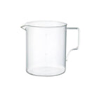 Clear glass pitcher on a white background